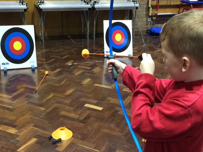 A child taking a shot in archery
