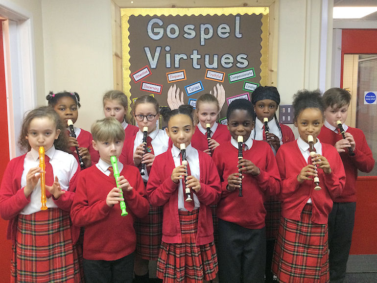 A group of children with their recorders