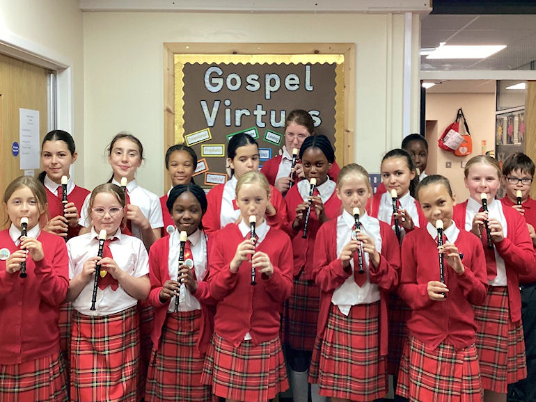 A group of children with their recorders